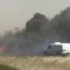 Smoke billows after a crash involving many vehicles shut down a motorway in Illinois