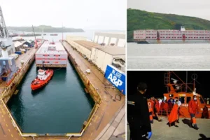 First giant barge set to house 500 migrants docks in Falmouth as ministers promise more boats on the way
