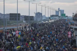 Tens of thousands march against populist Serbian leadership after mass shootings