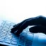 A hand on a laptop