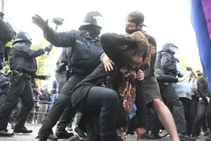 German protesters clash with police after woman jailed over attacks on neo-Nazis