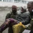 A civilian is taken to safety