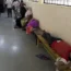 People in a hospital corridor