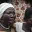 Relatives grieve as they wait to collect the bodies of villagers who were killed in the attack
