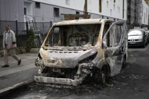 Macron scraps German trip amid rioting as teenager killed by police is buried