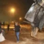 Israeli authorities inspect the remains of what the military said is a Syrian anti-aircraft rocket in Rahat