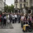 People gather in front of the city hall in Lyon