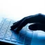A hand on a laptop