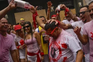 Thousands party in Pamplona as firework blast begins bull-running festival