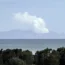 Plumes of steam rise above White Island off the coast of Whakatane, New Zealand after the eruption