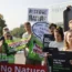 Greta Thunberg, right, and other activists demonstrate outside the European Parliament in Strasbourg