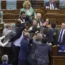Legislators push each other as a brawl breaks out in Kosovo’s parliament in Pristina