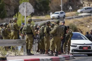 Two girls among injured after Palestinian gunman opens fire on car in West Bank