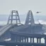 Helicopters tackle a fire on a bridge