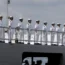 Chinese navy sailors stand in formation on board a naval training ship