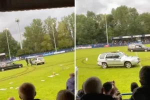 Football match abandoned after balaclava-clad men drive hearse onto pitch