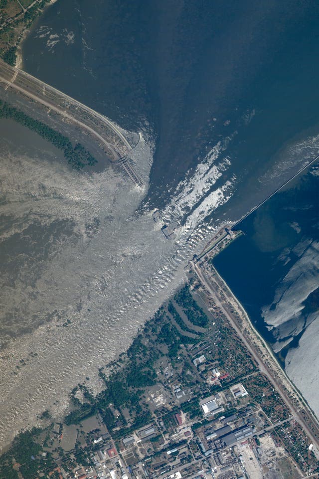 This satellite image provided by Planet Labs PBC shows an overview of the damage on the Kakhovka dam in southern Ukraine