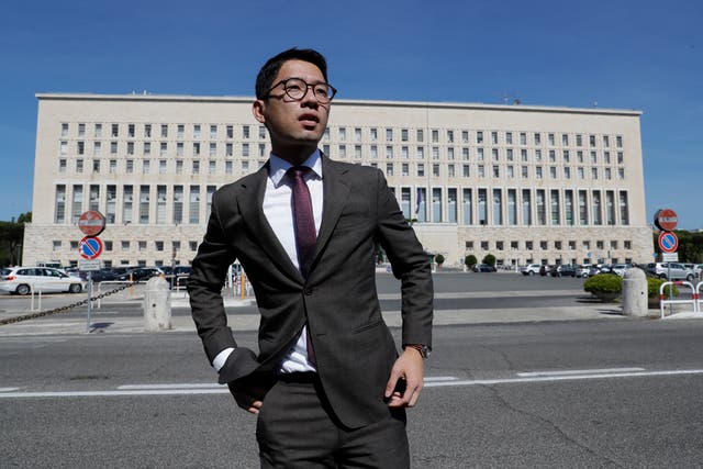 7452118381ad4995ab4f53da161a3321 Hong Kong activist Nathan Law takes part in a protest during a meeting of Chinese foreign minister Wang Yi and Italian foreign minister Luigi Di Maio, in Rome in 2020