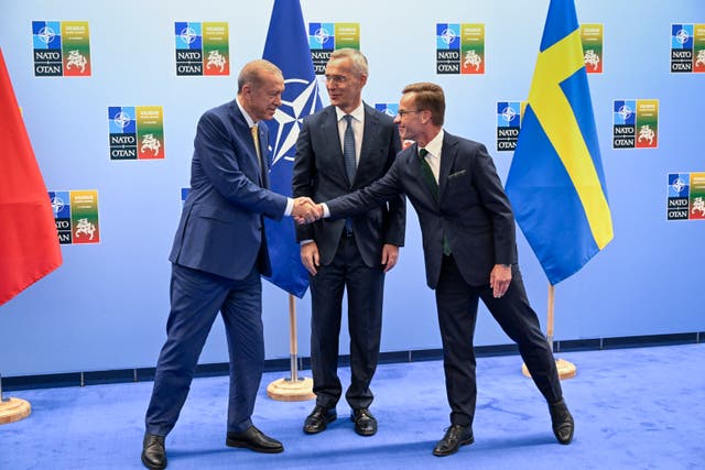 81b2778f310b48dfbd33df518cb7be39 Erdogan and Kristersson shake hands