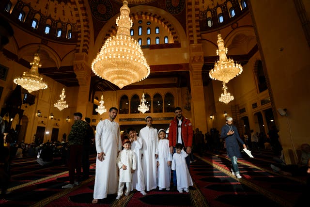 90929617094c4c239a3bfcd1d5fdf1a4 Worshippers pose for a photograph after offering Eid prayers at the Mohammad al-Amin Mosque in downtown of Beirut, Lebanon