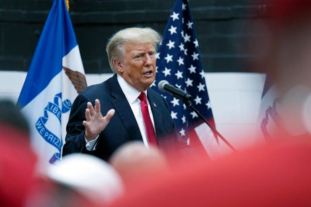 982b11b8458c4e3ea45a0f81fd12ce48 Former president Donald Trump visits with campaign volunteers at the Grimes Community Complex Park in Des Moines, Iowa