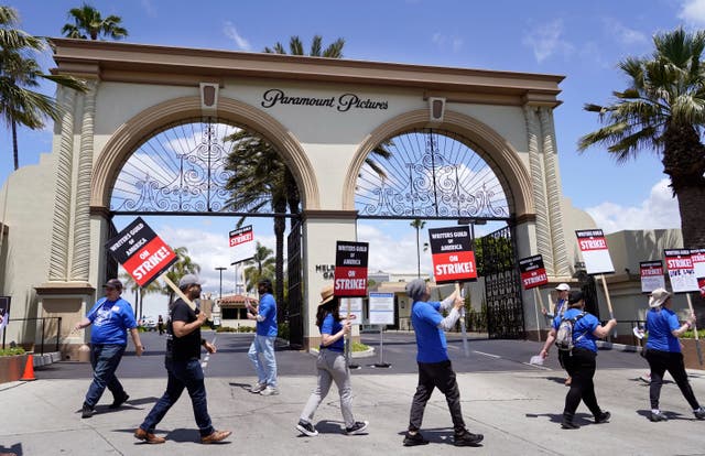 990500cbca01434f944a205e3c95da3d Members of the Writers Guild of America West picket at an entrance to Paramount Pictures in Los Angeles