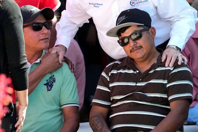 a78b31aa925f4b4b878fbfa8a4f346ef Wilson Garcia is consoled during a vigil