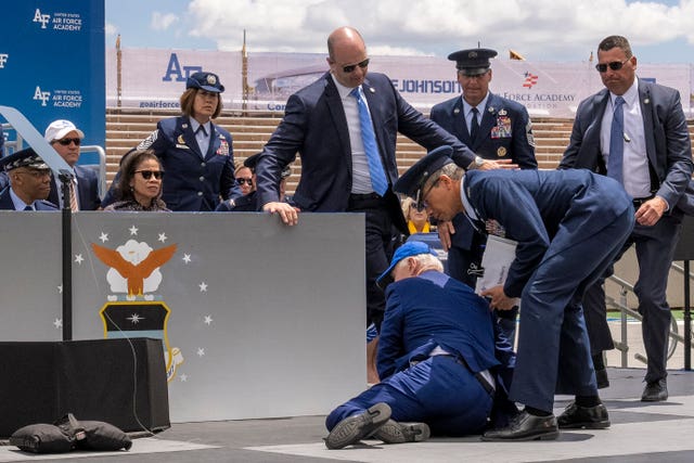 e9bd1534f07946719610ad8b284f471d President Joe Biden falls on stage during the 2023 United States Air Force Academy Graduation Ceremony at Falcon Stadium at the United States Air Force Academy in Colorado Springs, Colorado