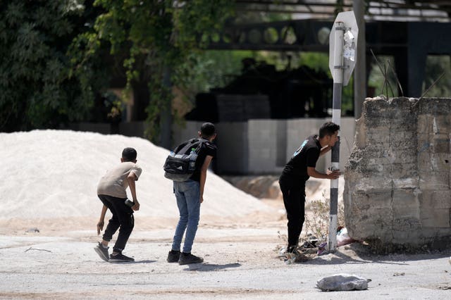 Palestinians take cover