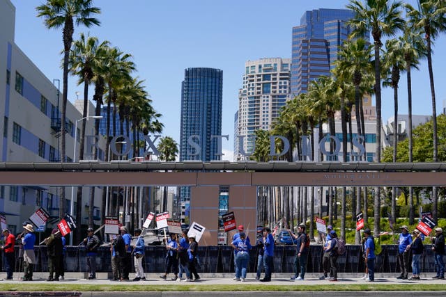 fa10bd345cd74a55983d00543421d0cd Members of the Writers Guild of America picket outside Fox Studios in Los Angeles