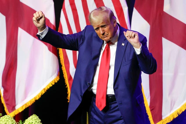 17156bbc04d74a3e9ce274396e6f9a6d Former US president Donald Trump dances as he leaves the stage after speaking at a fundraiser event for the Alabama GOP in Montgomery, Alabama