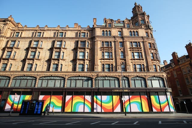 2-52976901 Rainbow displays adorn the windows of Harrods department store