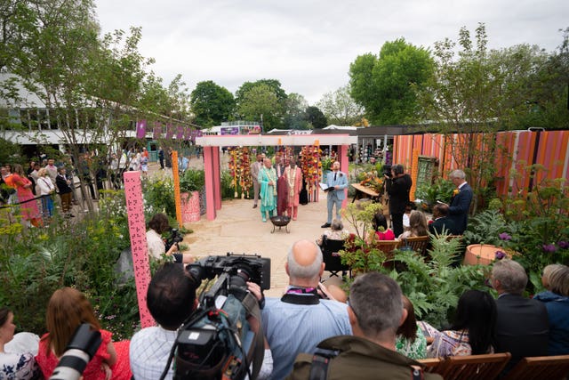 2-72295986 Clive Gillmor and Manoj Malde take part in the first wedding ceremony to be held at the RHS Chelsea Flower Show