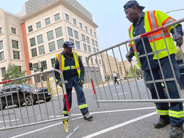 207022f7e2dd4ea290b50aeced529464 Workers put up barricades and secure the area outside the E. Barrett Prettyman U.S. Federal Courthouse