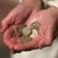 A woman holding coins