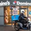 A Domino’s store and delivery rider