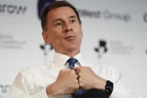Chancellor urges Tories not to talk the country down as he hints at tax cuts