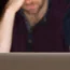 A man looking at a laptop
