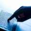 A hand on a laptop