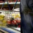 A supermarket shopper with a basket of fruit and veg