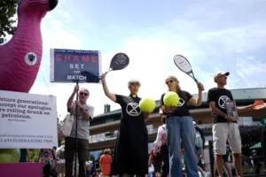 Climate activists protest against Barclays’ sponsorship outside Wimbledon gate