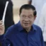 Cambodian prime minister Hun Sen of the Cambodian People’s Party (CPP) raises a ballot (Heng Sinith/AP)