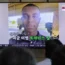 A TV shows an image of American soldier Travis King during a news programme at Seoul Railway Station in South Korea