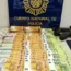 Money, weapons and documents seized in a raid