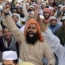 Supporters of a religious group in Pakistan protest at the burning of the Koran in Sweden