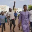 Supporters of Nigerien president Mohamed Bazoum show their support in Niamey, Niger, on Wednesday