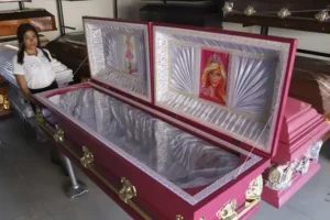 Funeral home offers pink coffins with Barbie lining