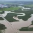 Floodwaters course through fields and roads in Kaiyuan Town of Shulan in north-eastern China’s Jilin province