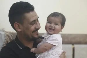 Baby born under rubble of Syrian quake a picture of happiness six months on
