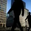 Office workers and commuters walking through Canary Wharf in London